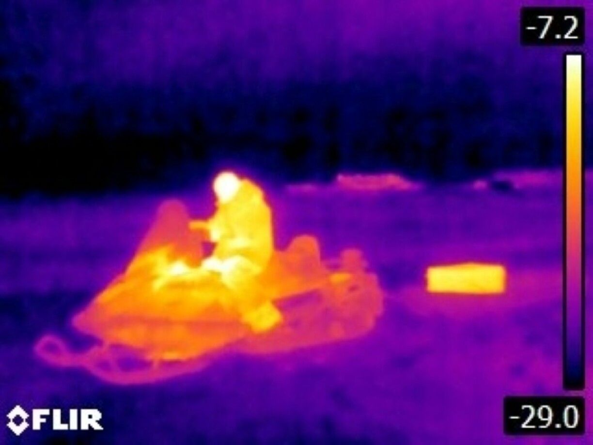 A Canadian soldier sits on a snow mobile during Operation Nanook, army's annual Arctic training operation, in Tuktoyaktuk, Canada in February 2025
