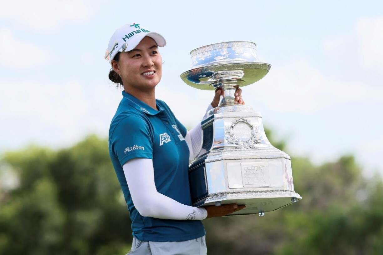 Minjee Lee of Australia poses with the trophy after winning the Women's PGA Championship in Frisco, Texas