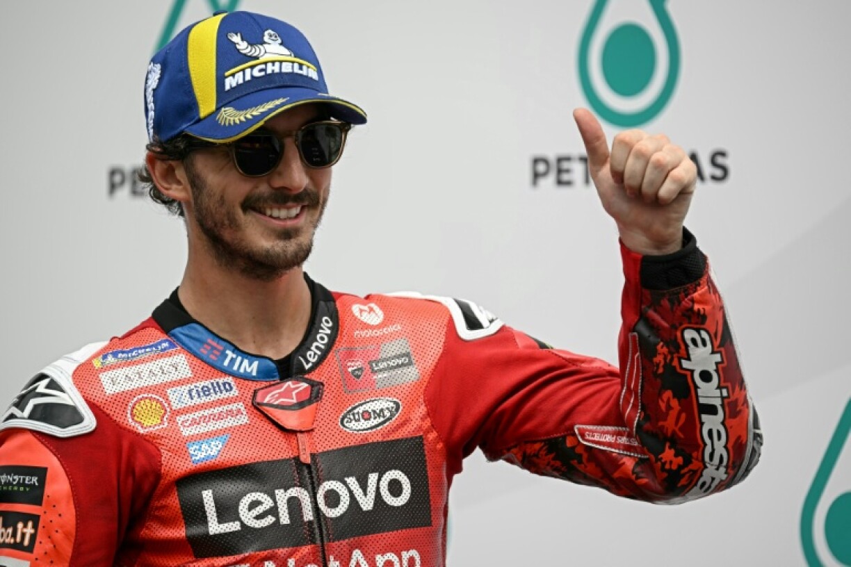 Italian MotoGP rider Francesco Bagnaia celebrates coming first in qualifying