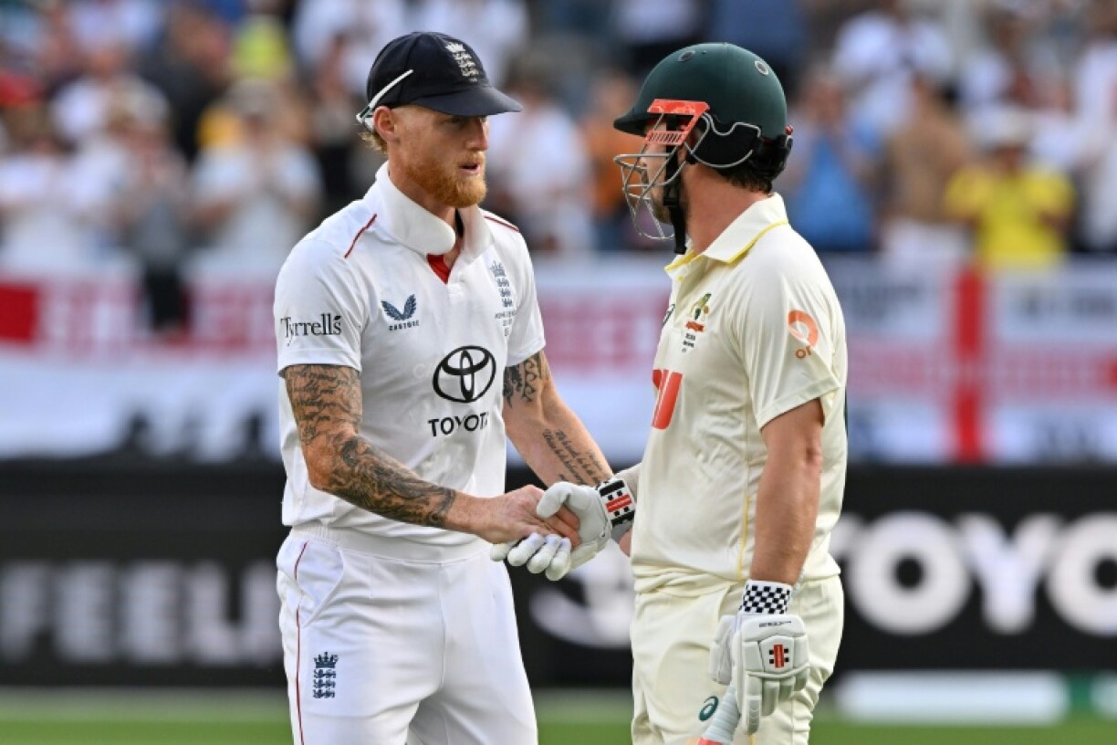 England’s captain Ben Stokes (L) congratulates Travis Head after his whirlwind 123