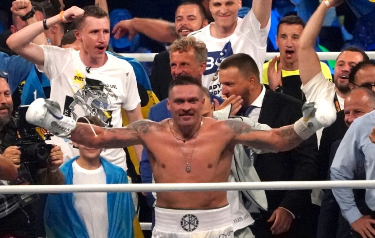 Ukraine's Oleksandr Usyk celebrates victory against Britain's Daniel Dubois in Poland in August 2023