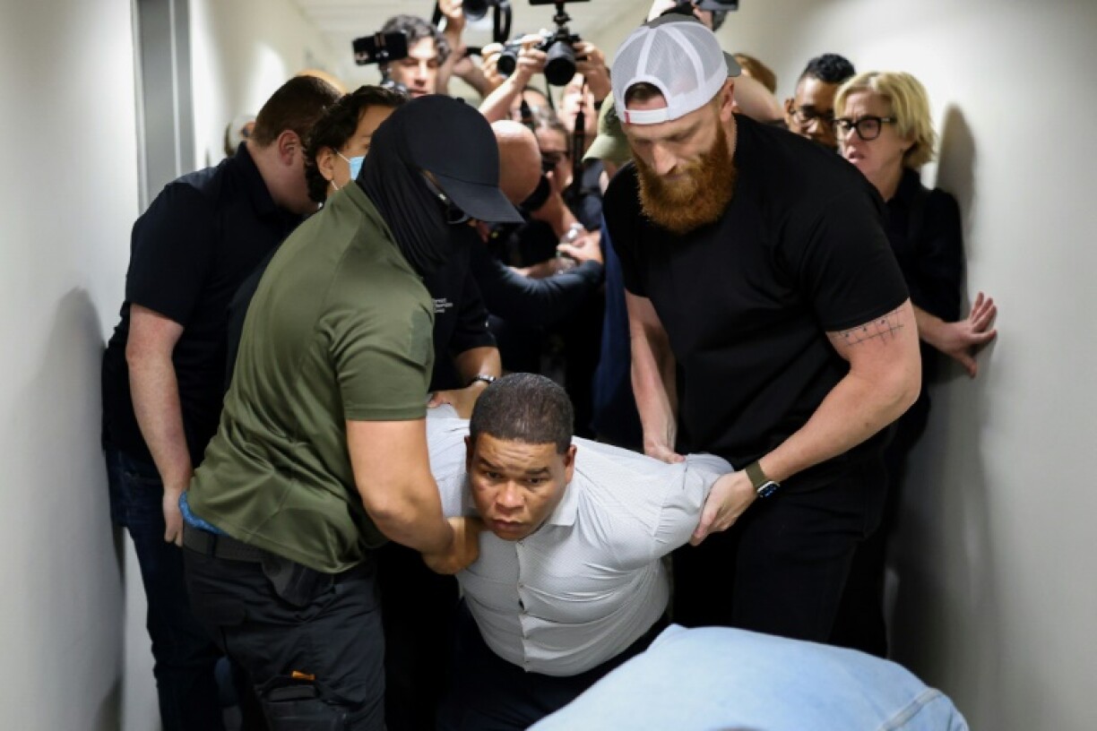 Dominican national Joaquín Rosario, 34, is detained by a masked Immigration and Customs Enforcement agent at the exit of the courtroom where he voluntarily attended an immigration hearing