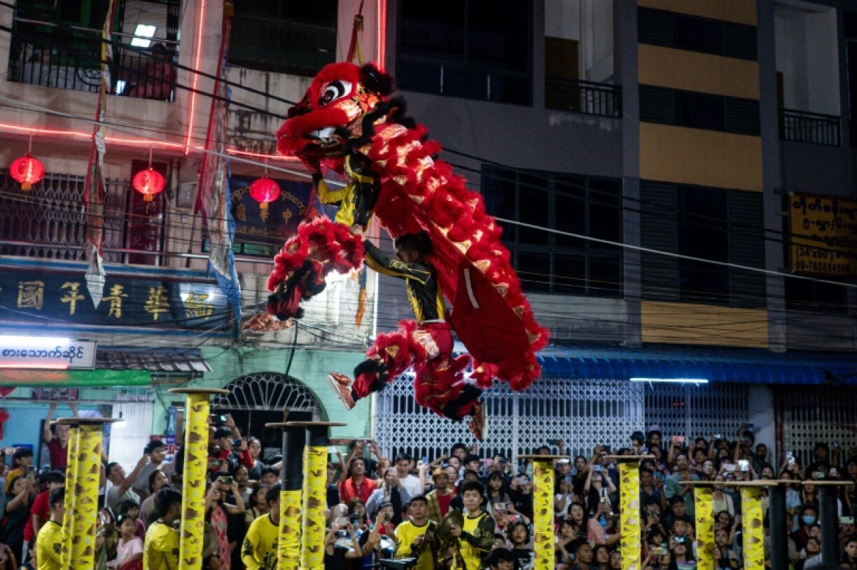 Lion dancers perform ahead of the Lunar New Year celebrations in the Chinatown district of Yangon, Myanmar