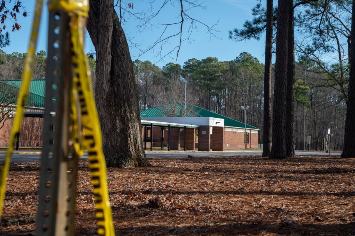 Police tape hangs from a sign post outside Richneck Elementary School following a shooting on January 7, 2023 in Newport News, Virginia. A 6-year-old student was taken into custody after reportedly shooting a teacher during an altercation in a classroom at Richneck Elementary School on Friday. The teacher, a woman in her 30s, suffered “life-threatening” injuries and remains in critical condition, according to police reports.