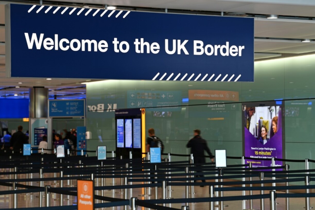 A large sign welcomes travellers arriving at passport control in Terminal 2 at London's Heathrow Airport