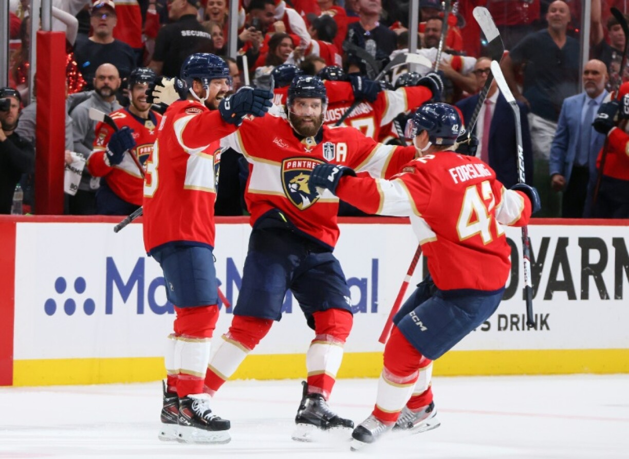 Sam Reinhart, left, scored four goals to lead the Florida Panthers over Edmonton 5-1 as the team celebrated a second consecutive NHL Stanley Cup crown