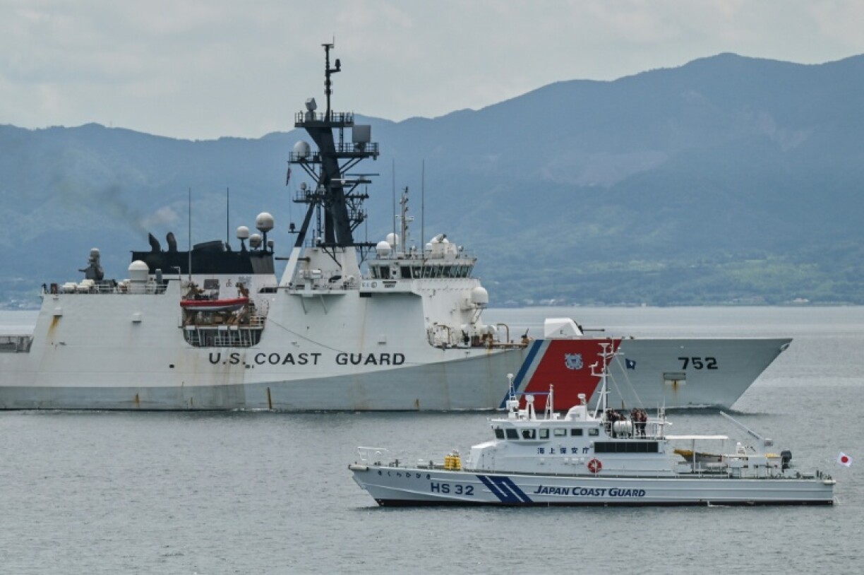 The United States Coast Guard ship Cutter Stratton (L) sails past a smaller Japan Coast Guard vessel during exercises this week