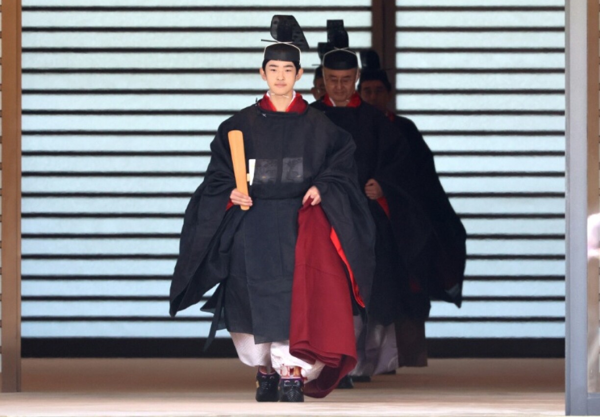 Japanese Prince Hisahito wearing an ancient ceremonial costume, leaves for a ceremony by a carriage at the Imperial Palace in Tokyo