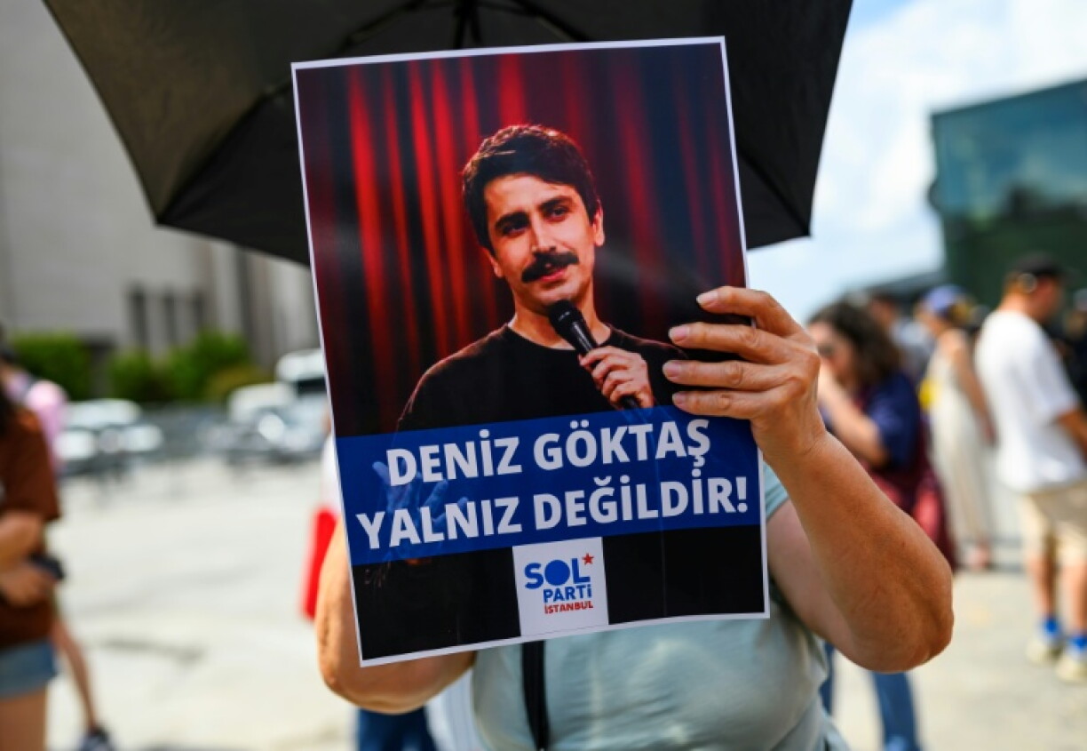 The comedian was arrested on July 3, bringing protesters onto the streets with signs saying 'Deniz Goktas is not alone!'