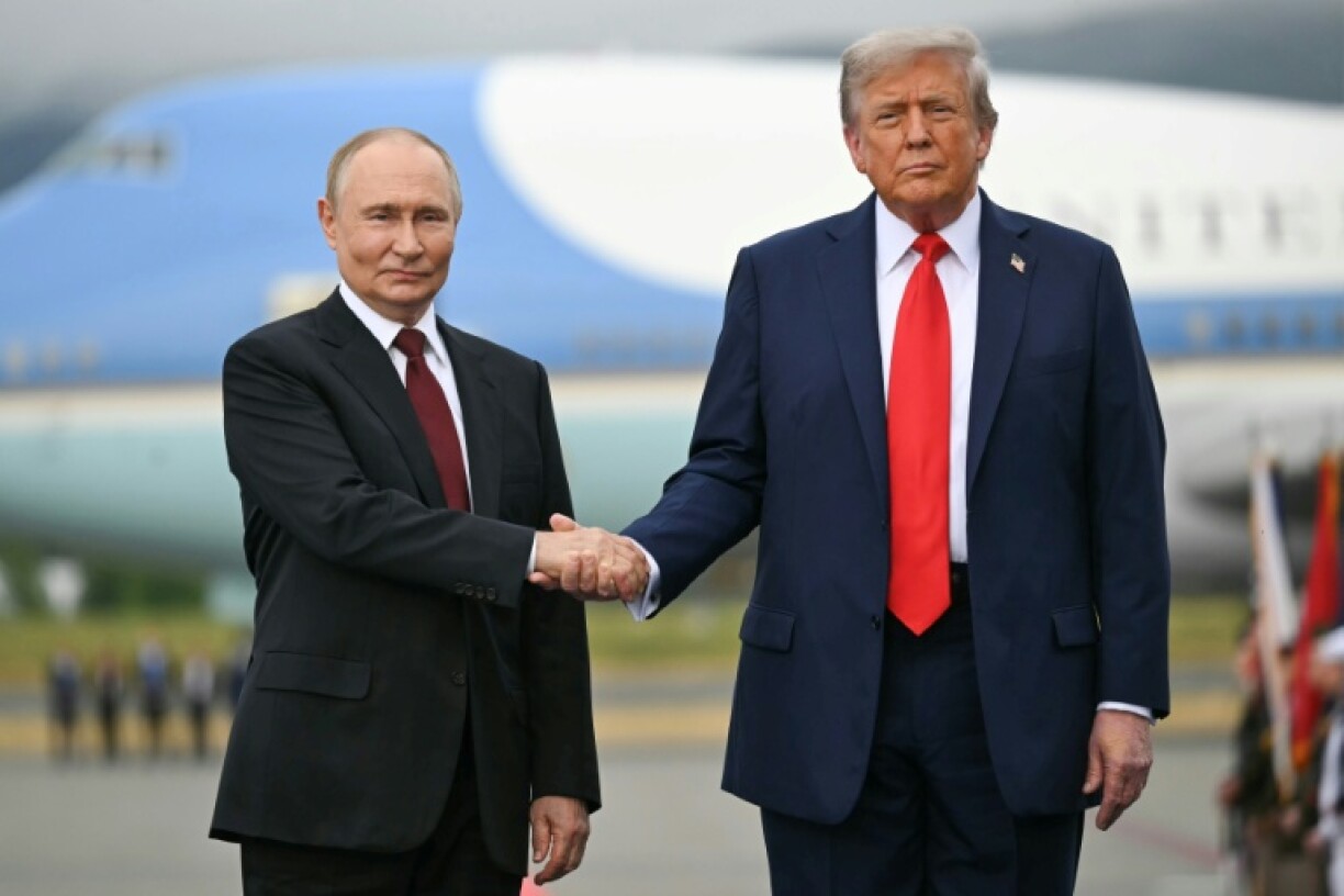 Trump and Putin shake hands during their meeting in Alaska a week ago