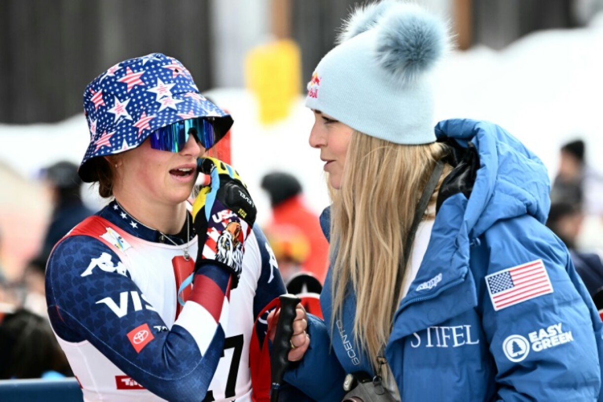 Lindsey Vonn (R) speaks with fellow American and first-time World Cup winner Lauren Macuga after the women's super-G in Sankt Anton