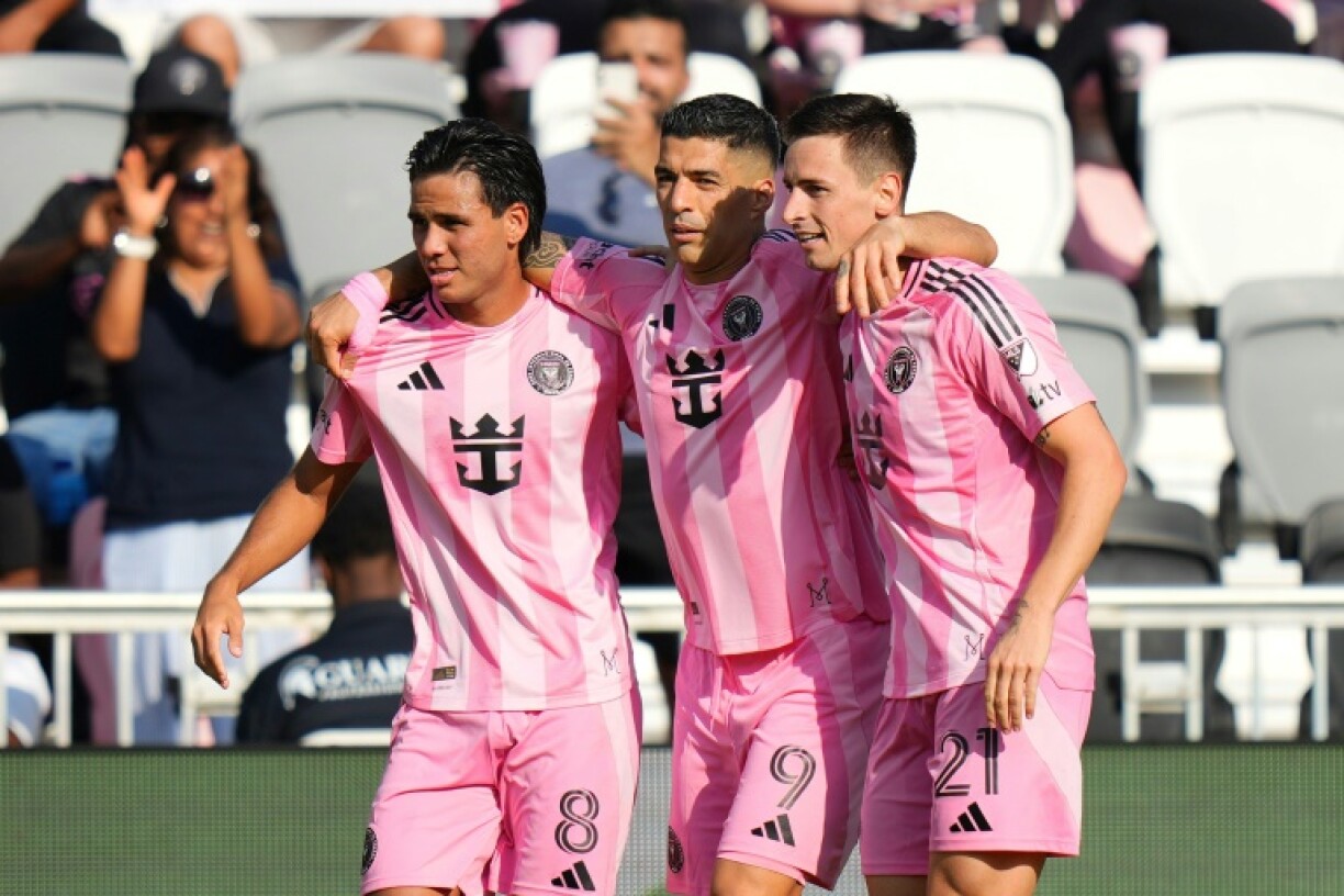 Tadeo Allende #21 of Inter Miami celebrates with teammates Luis Suárez #9 and Telasco Segovia #8 after scoring in the 1-0 win over Charlotte in MLS on Sunday.