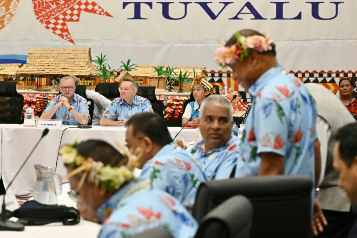Australia's Prime Minister Anthony Albanese (L) and Australia's Minister for Climate Change and Energy Chris Bowen, President of COP31 negotiations, attend a Pacific Pre-COP31 leaders event in Funafuti, Tuvalu, on October 6, 2026