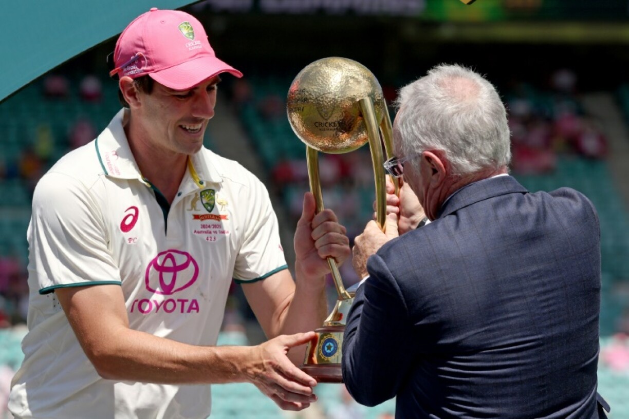 Australia captain Pat Cummins receives the Border-Gavaskar Trophy after winning the fifth Test in Sydney to clinch the series 3-1