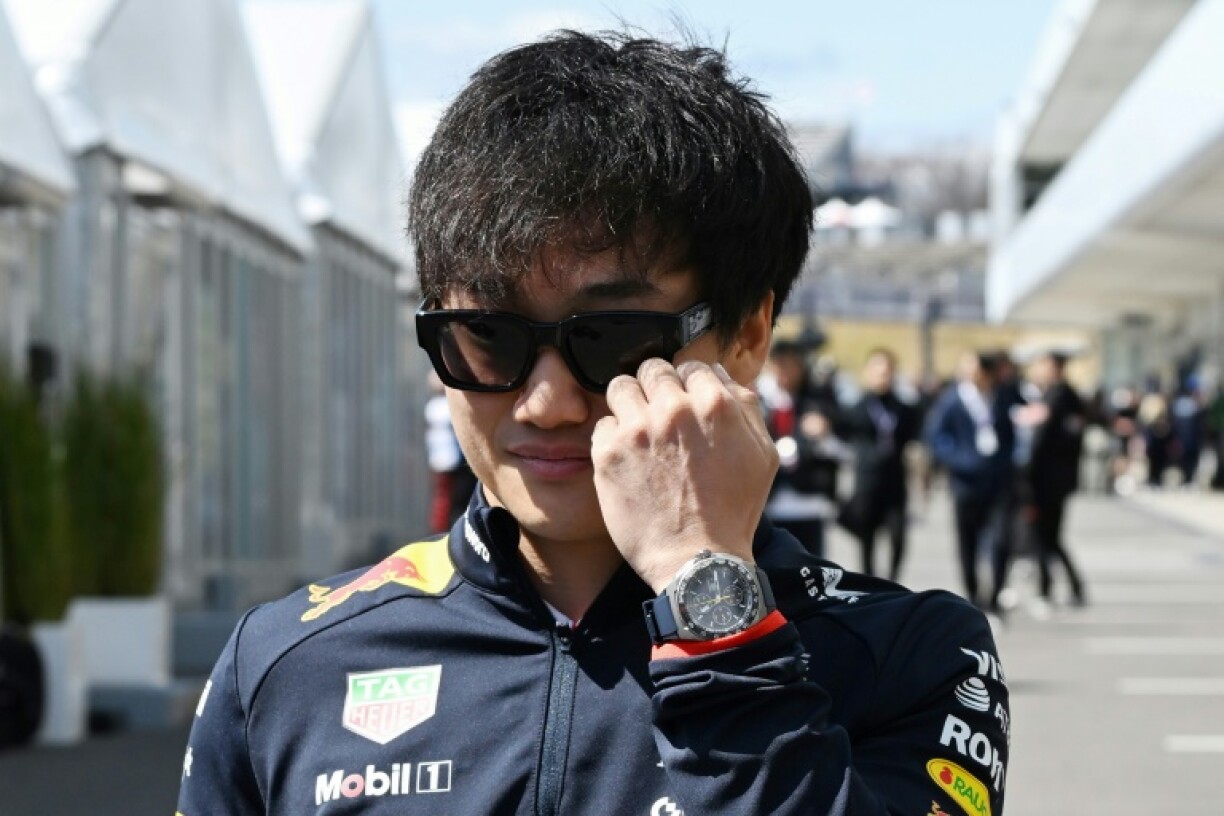 Yuki Tsunoda walks in the paddock ahead of the Formula One Japanese Grand Prix