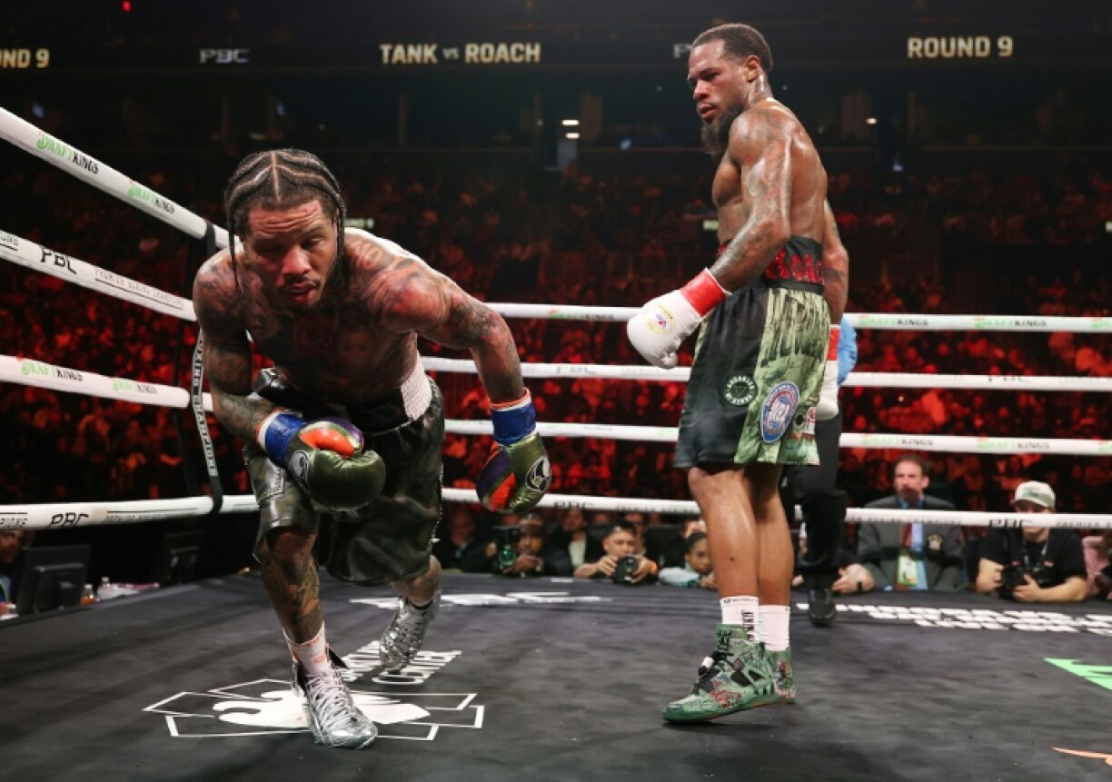 Gervonta Davis takes a knee due to the grease in his braids dripping into his eyes in round nine of his lightweight world title defense against Lamont Roach