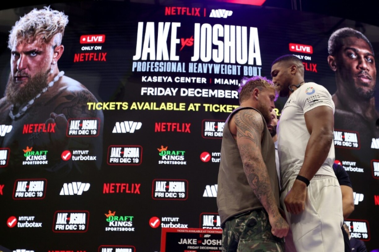 Jake Paul (left) and Anthony Joshua (right) face off at a press conference ahead of their Netflix-backed heavyweight fight next month