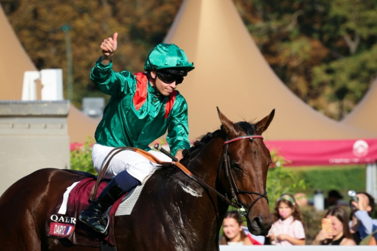 French jockey Mickael Barzalona and Daryz after winning the Prix de l'Arc de Triomphe