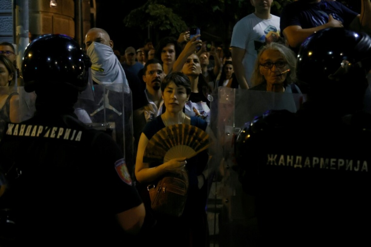 Serbian riot police again faced off against anti-government protesters in Belgrade on Thursday night