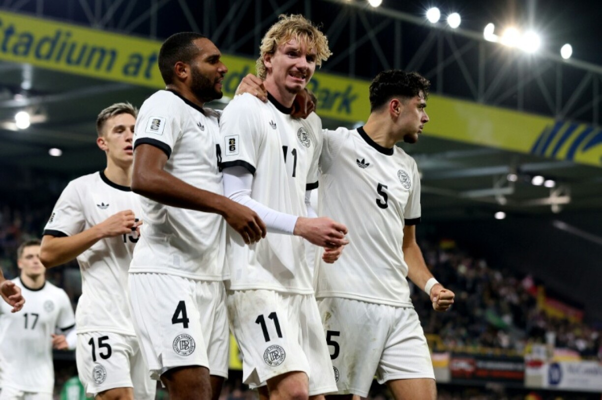 Nick Woltemade (C) celebrates after scoring the winner for Germany against Northern Ireland in Belfast
