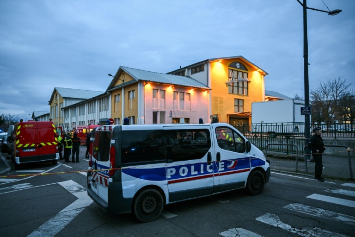 Police and military personnel guarded the perimeter of a covered market in Mulhouse after the stabbing attack