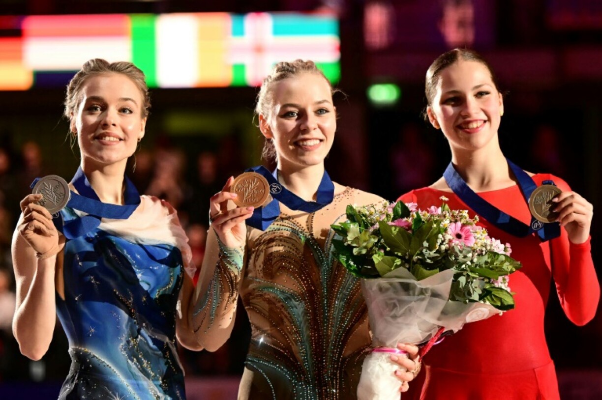 Niina Petrokina (centre) takes gold in front of her home Estonian fans