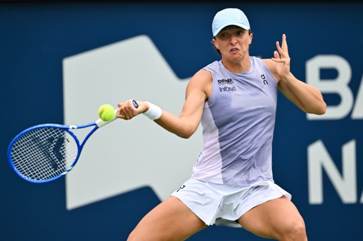 Poland's Iga Swiatek plays a forehand on the way to victory over China's Guo Hanyu in the WTA Canadian Open