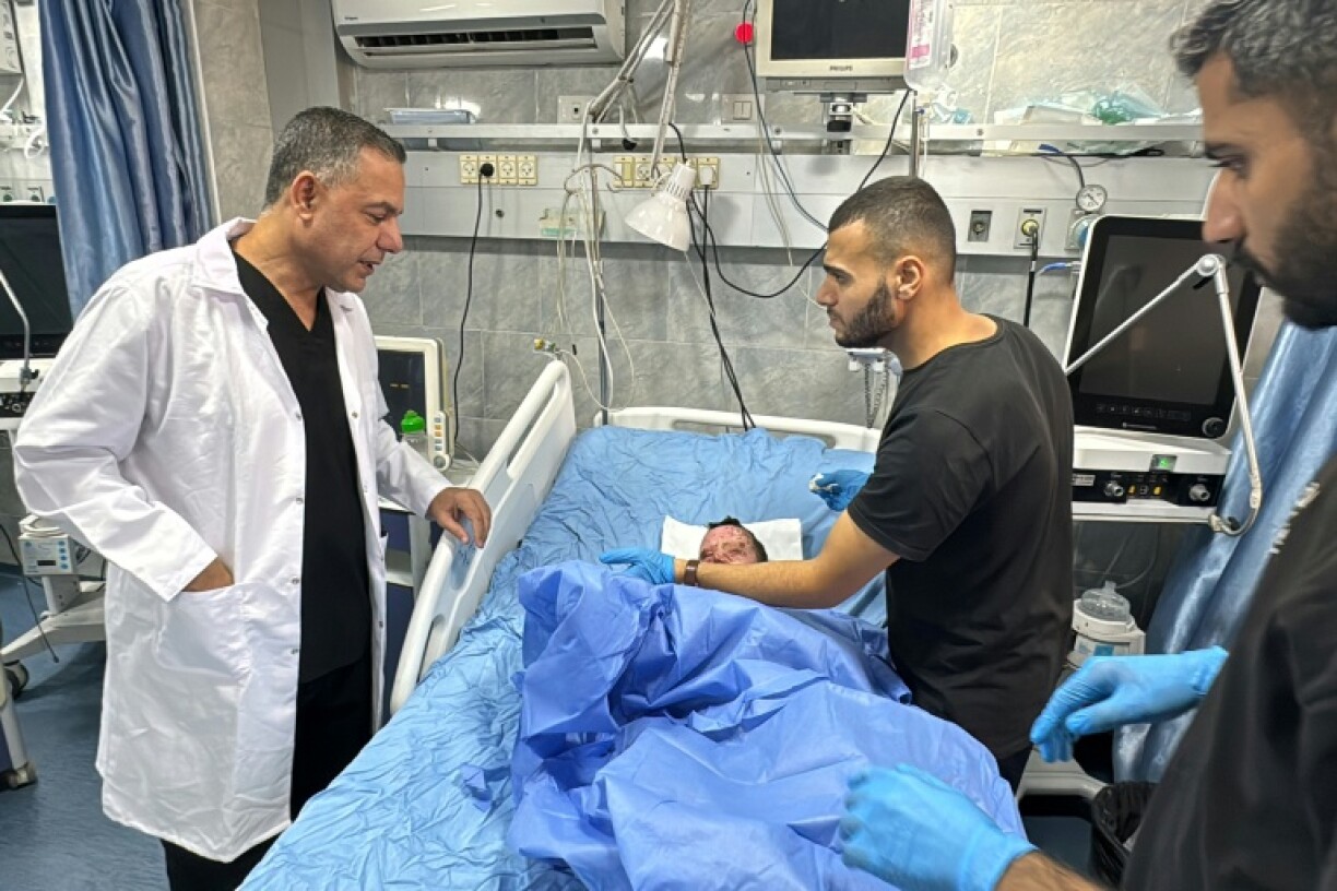 Kamal Adwan hospital chief, Hossam Abu Safiyeh, checking an injured child on October 24, 2024 amid the ongoing war in Gaza