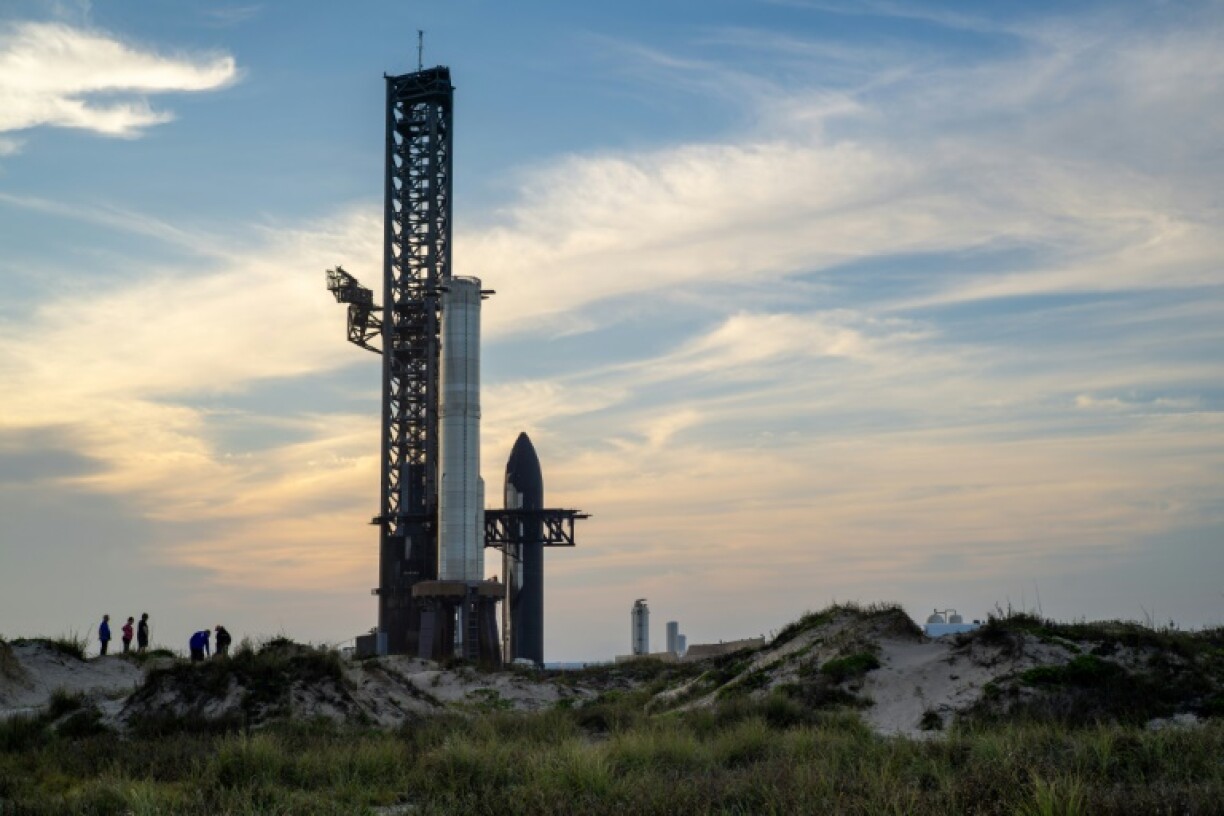 People view SpaceX Starship Flight 8 as it is stationed near Orbital Launch Pad A ahead of launch at Boca Chica beach in Texas on March 3, 2025