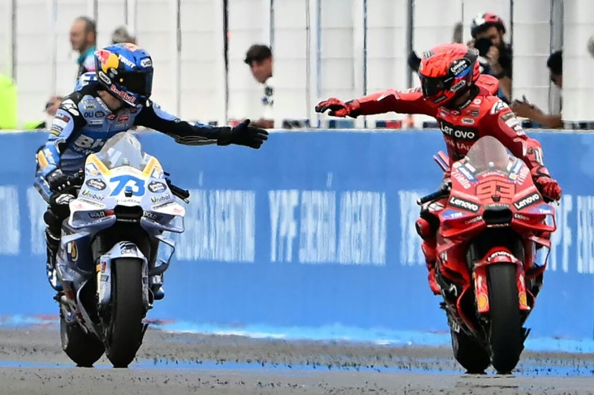 Brothers in arms: Marc Marquez (R) with brother Alex after finishing first and second at the Argentina MotoGP