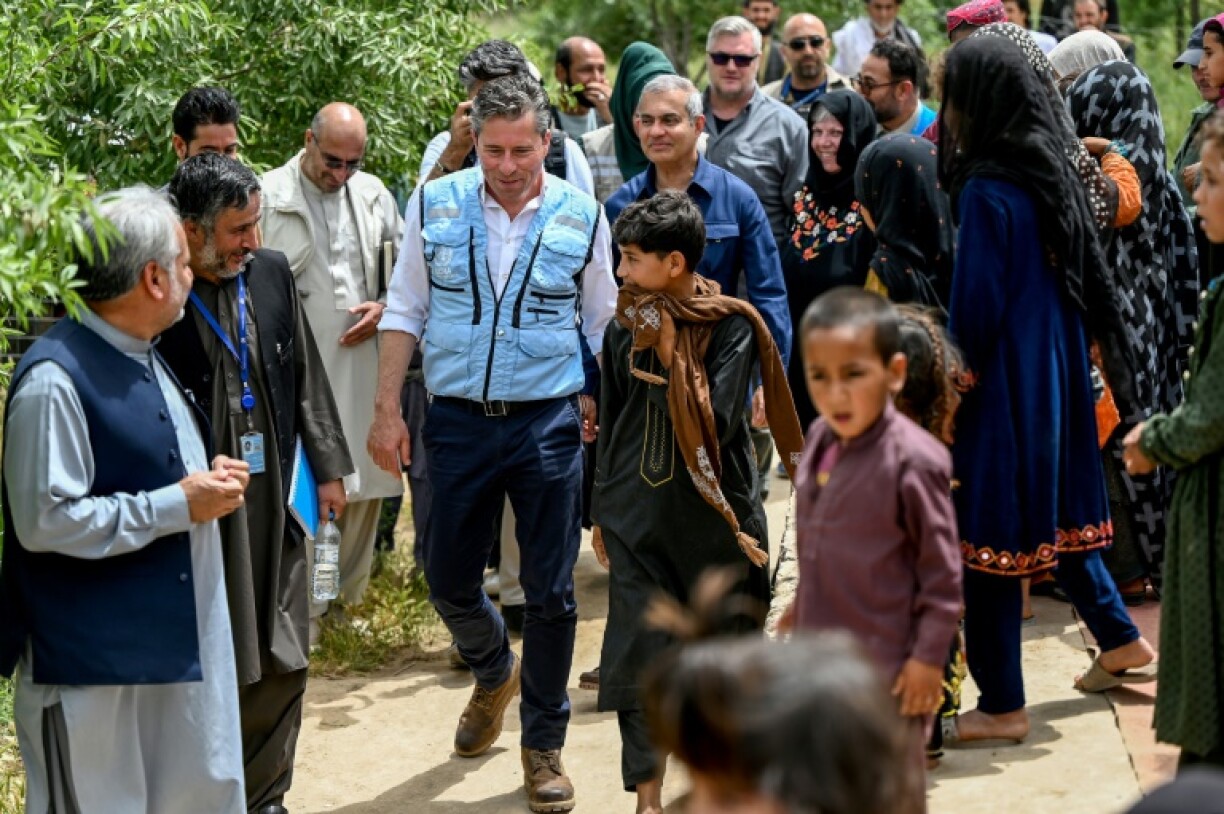 United Nations Under-Secretary-General for Humanitarian Affairs and Emergency Relief Coordinator Tom Fletcher (C) arrives for a visit to the Just for Afghan Capacity and Knowledge (JACK) Mobile Healthcare Centre in Kunduz Province