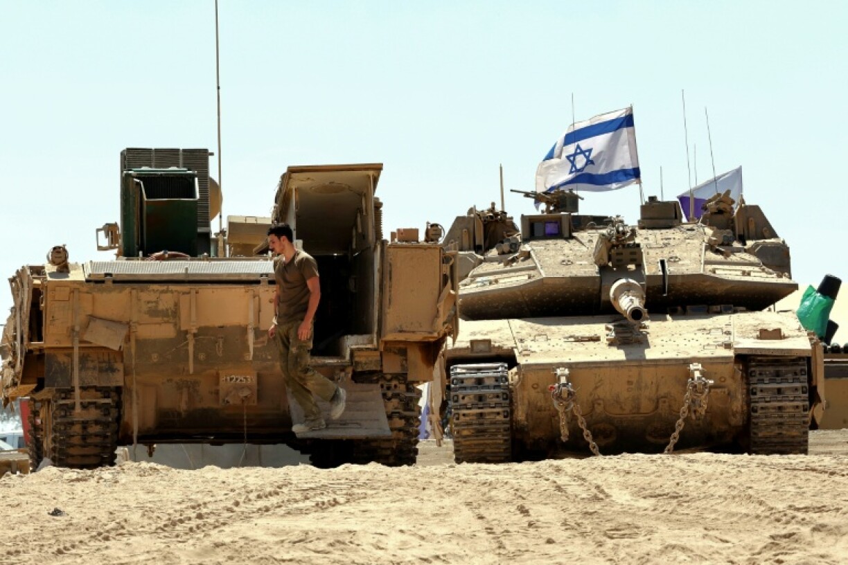 Israeli armoured vehicles near the border with the Gaza Strip, as the military prepares a new offensive in Gaza City