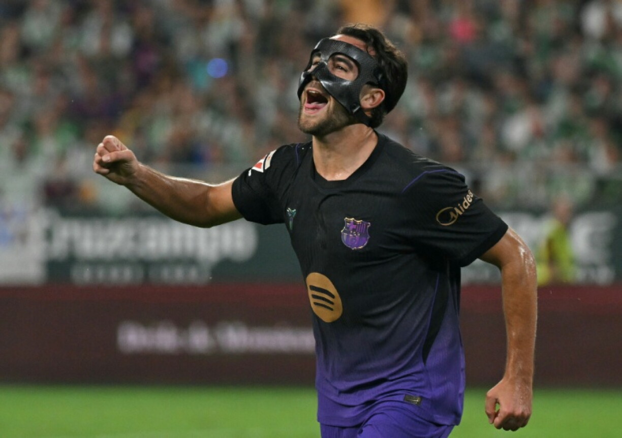 Barcelona defender Eric Garcia celebrates scoring against Betis but is out with an injury he picked up in the game