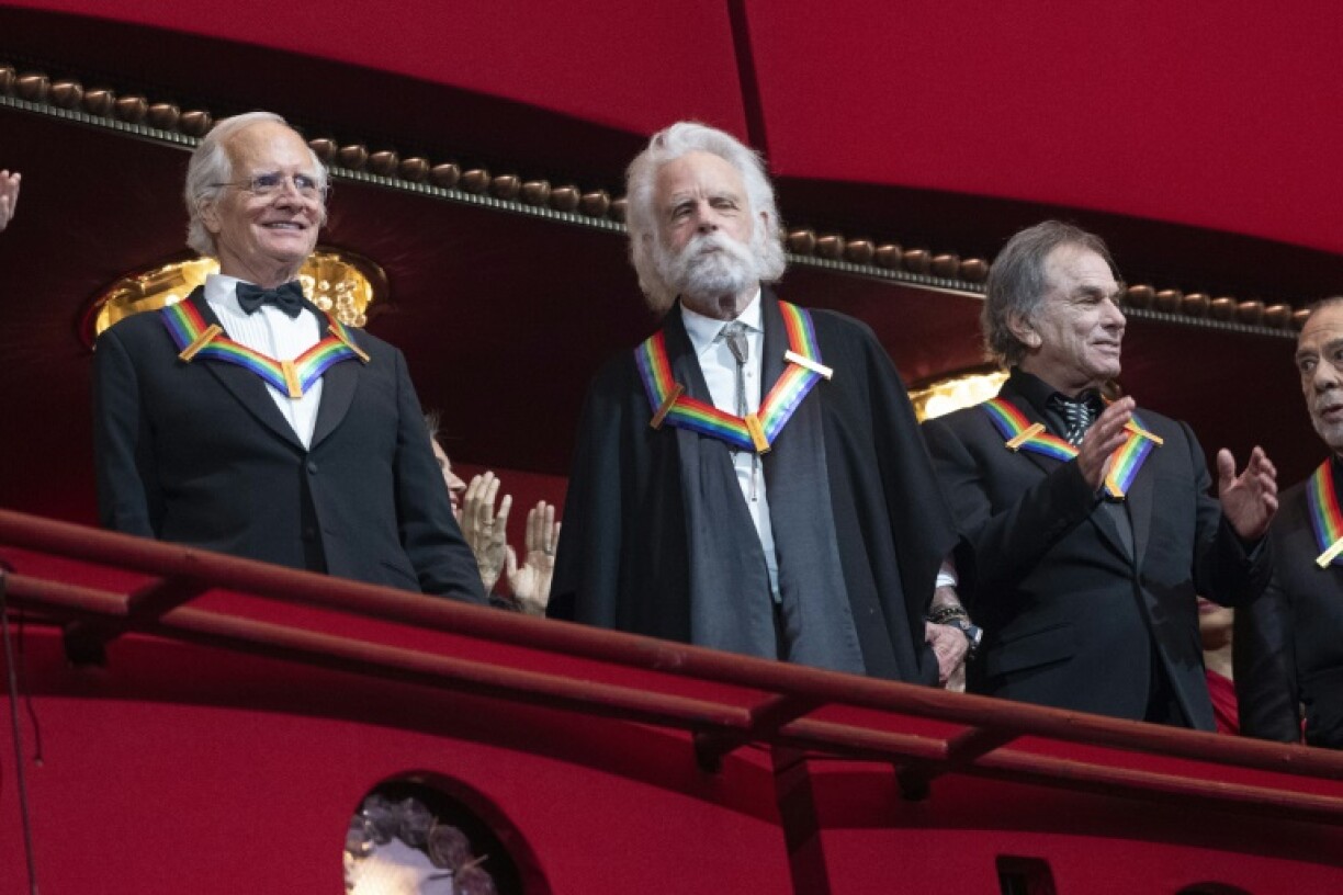 Musicians Bill Kreutzman, Bob Weir and Mickey Hart of the Grateful Dead are applauded as they are inducted into the prestigious pantheon of Kennedy Center honorees