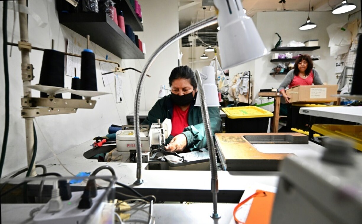 Seamstresses from the Garment Worker Center sew lingerie in the back room of Cantiq