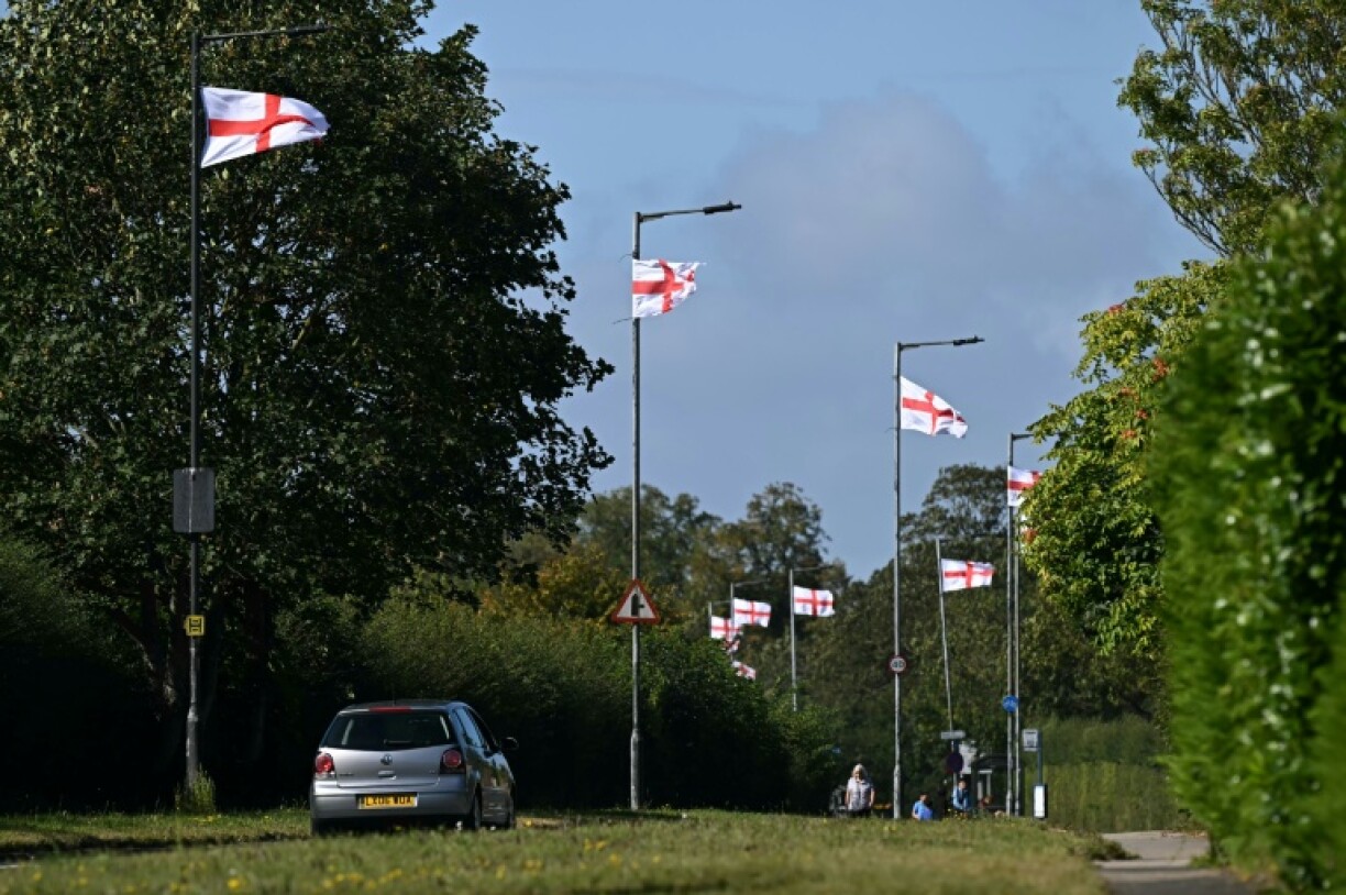 St George's flags fly from lampposts in York, northern England, as a new trend for flying such pennants including the Union Jack has emerged in recent weeks in a display of patriotism linked to the far-right