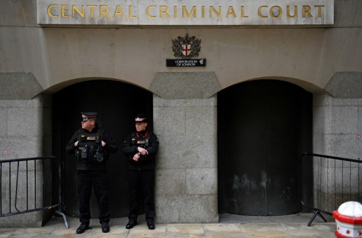 Police stand guard outside London's Old Bailey court