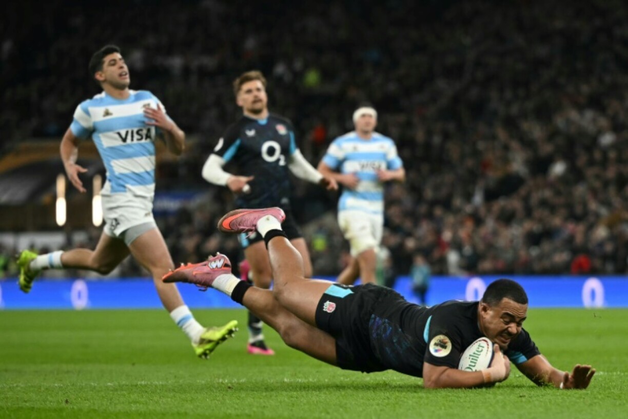 Max Ojomoh dives over the line to score the first try in England's 27-23 Autumn Nations Series win over Argentina at Twickenham
