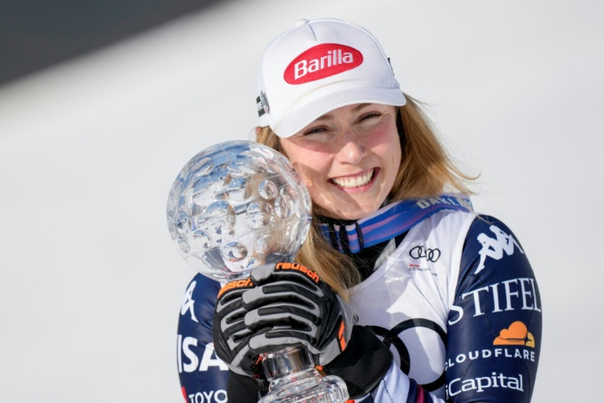 Mikaela Shiffrin poses with her crystal globe trophy for the overall slalom World Cup in March