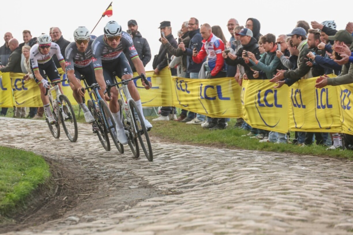 Tadej Pogacar about to attack Van der Poel and Jasper Philipsen