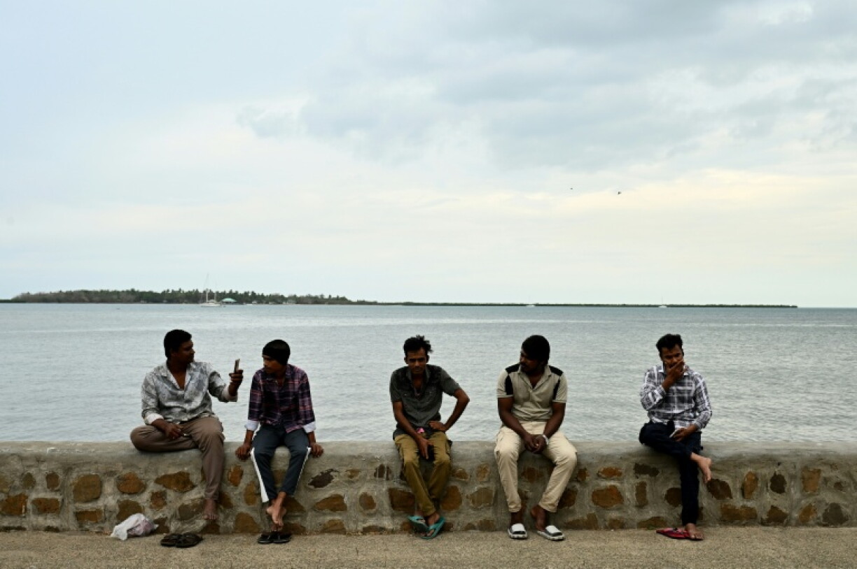 Residents spend their morning on a beach next to the port in Nadi on October 4, 2026, ahead of the Pacific Pre-COP31 Summit's opening ceremony.