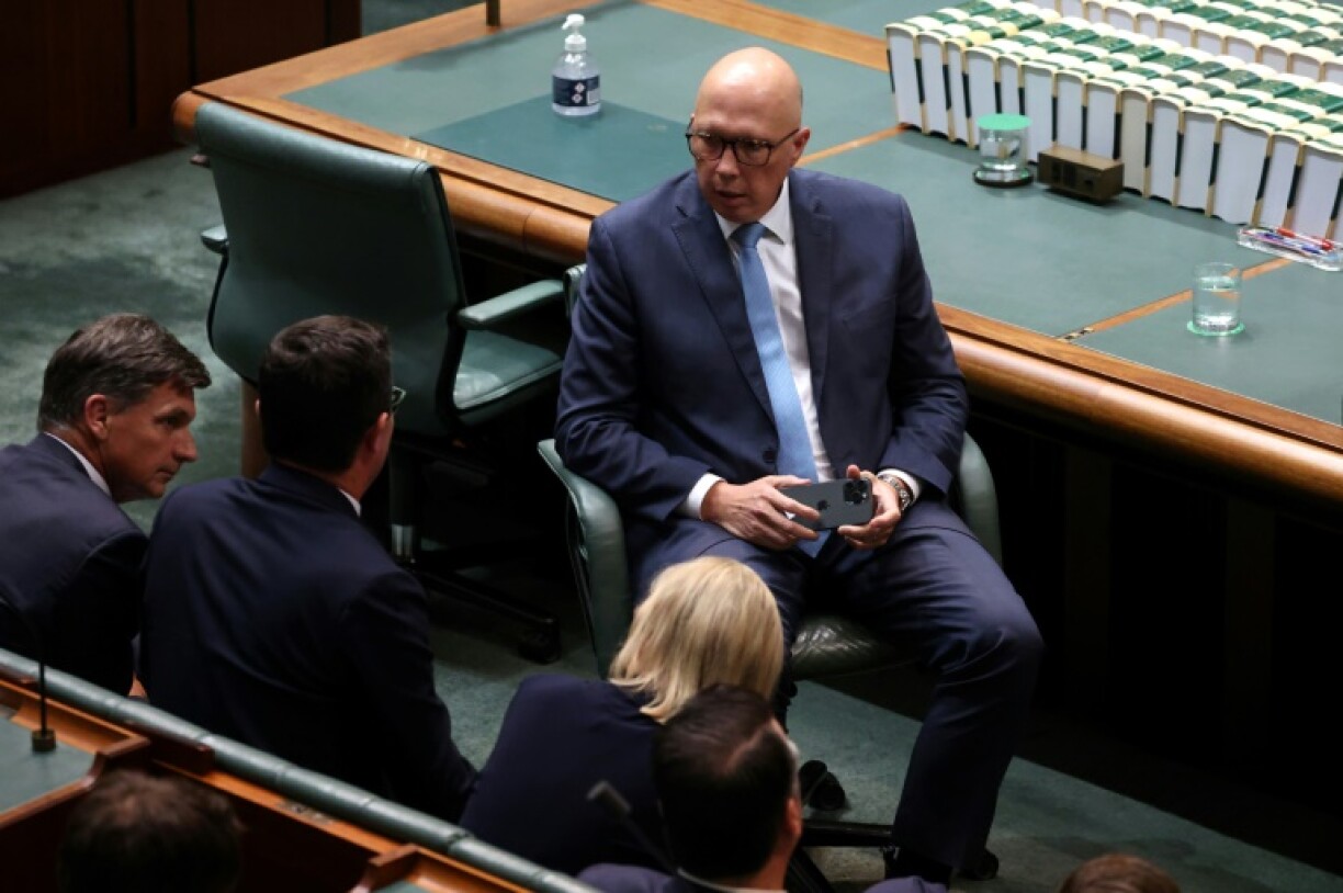 Australian oppposition leader Peter Dutton talks to members after Treasurer Jim Chalmers delivered his fourth federal budget speech at Parliament House in Canberra on March 25