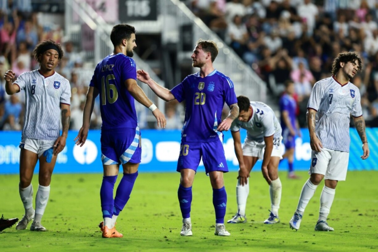 Alexis Mac Allister, right, celebrates his second goal with teammate Jose Manuel Lopez as Argentina routed Puerto Rico 6-0 in an international football friendly
