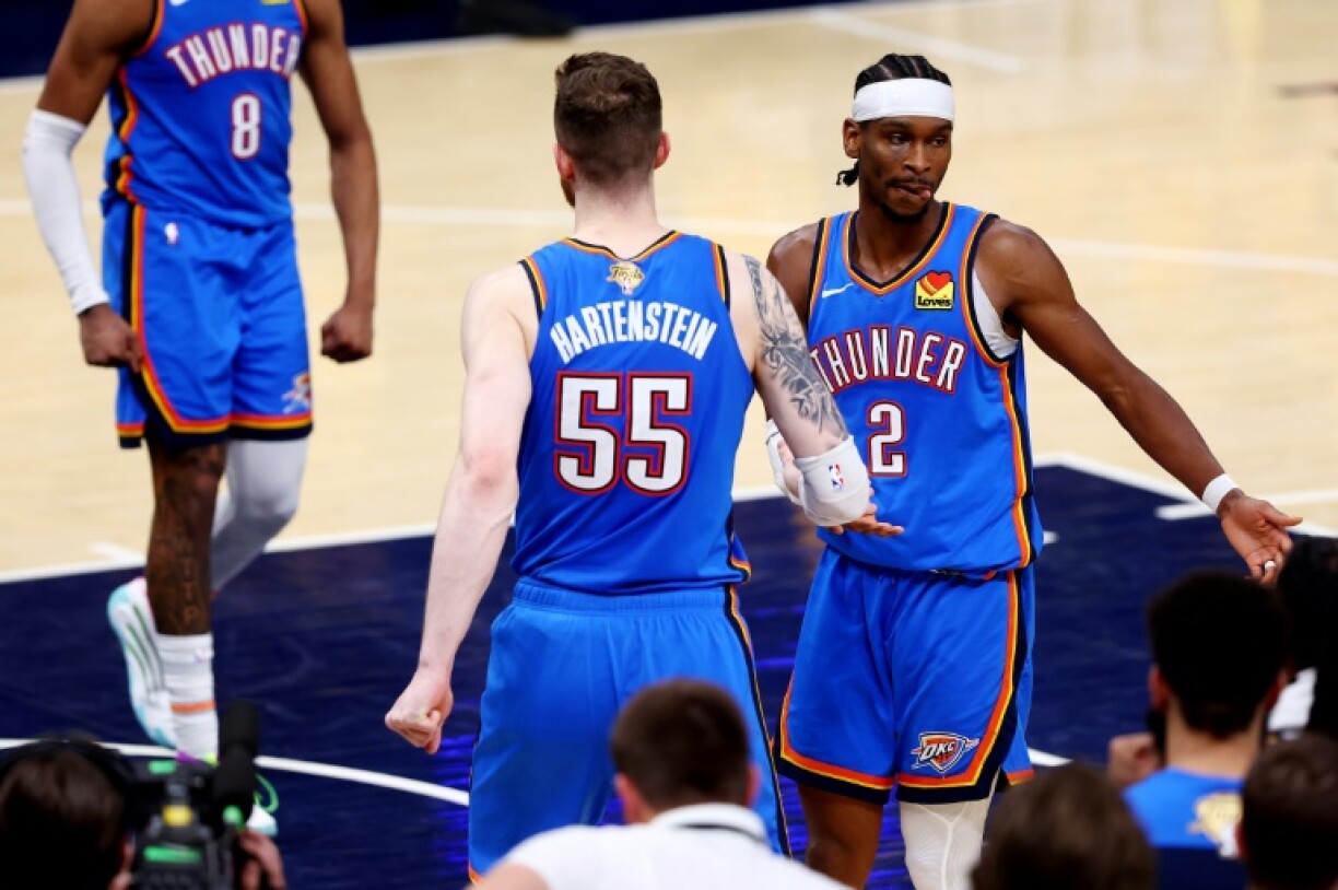 Shai Gilgeous-Alexander of the Oklahoma City Thunder and teammate Isaiah Hartenstein celebrate during the fourth quarter of the Thunder's victory over the Indiana Pacers in game four of the NBA Finals