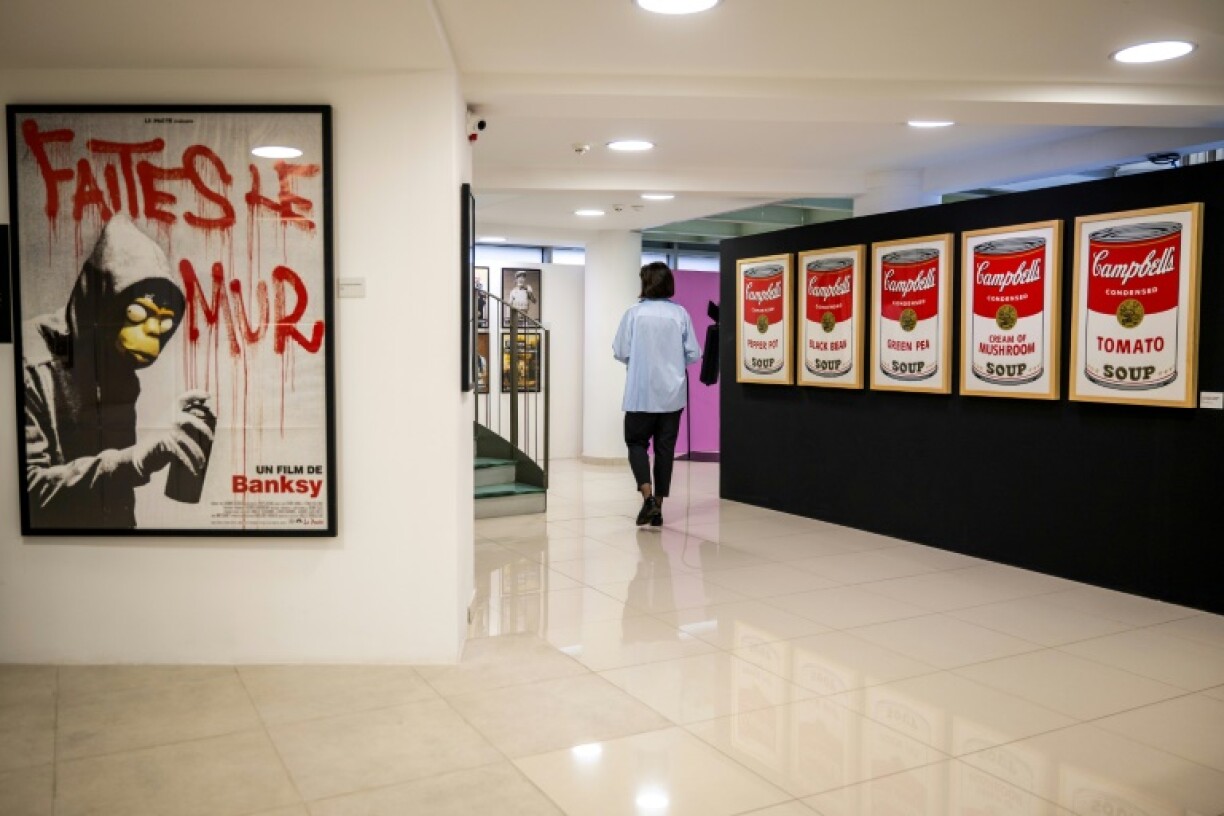 A woman visits a Belgrade gallery with an exhibition devoted to secretive street artist Banksy