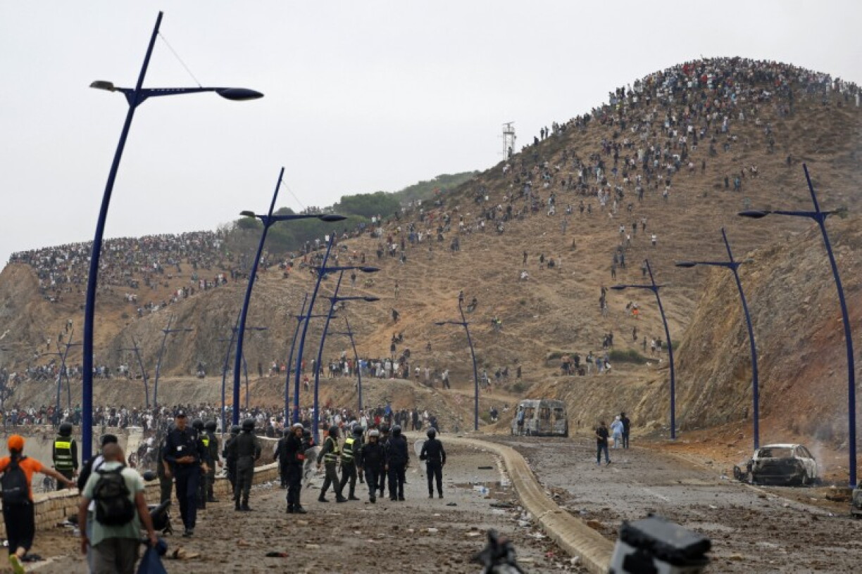 Members of Moroccan security forces gather at the site of clashes near Fnideq, on the Morocco-Spain border, on July 31, 2026