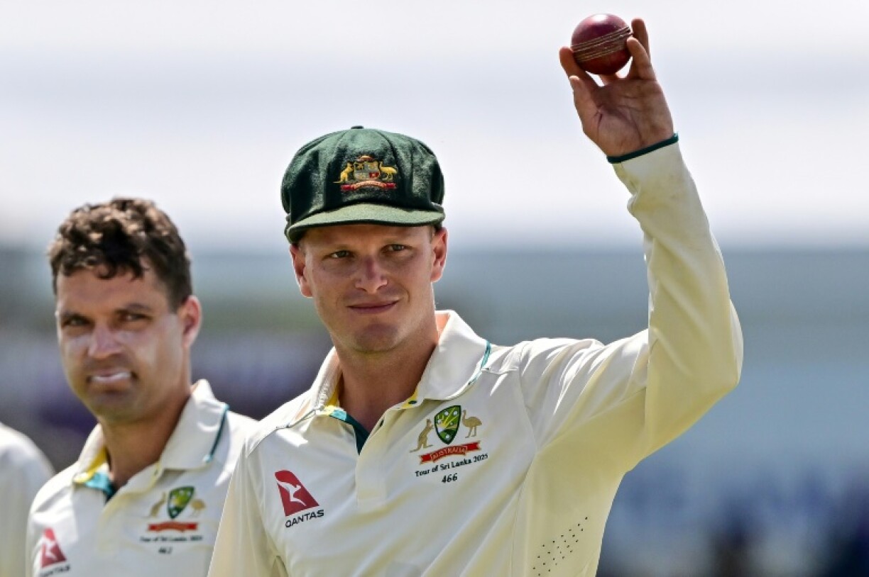 Australia's Matthew Kuhnemann (R) celebrates his five-wicket haul in the first Test against Sri Lanka