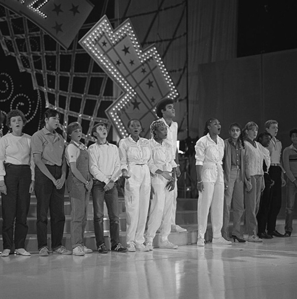 Boney M, the four centre figures dressed in white.
