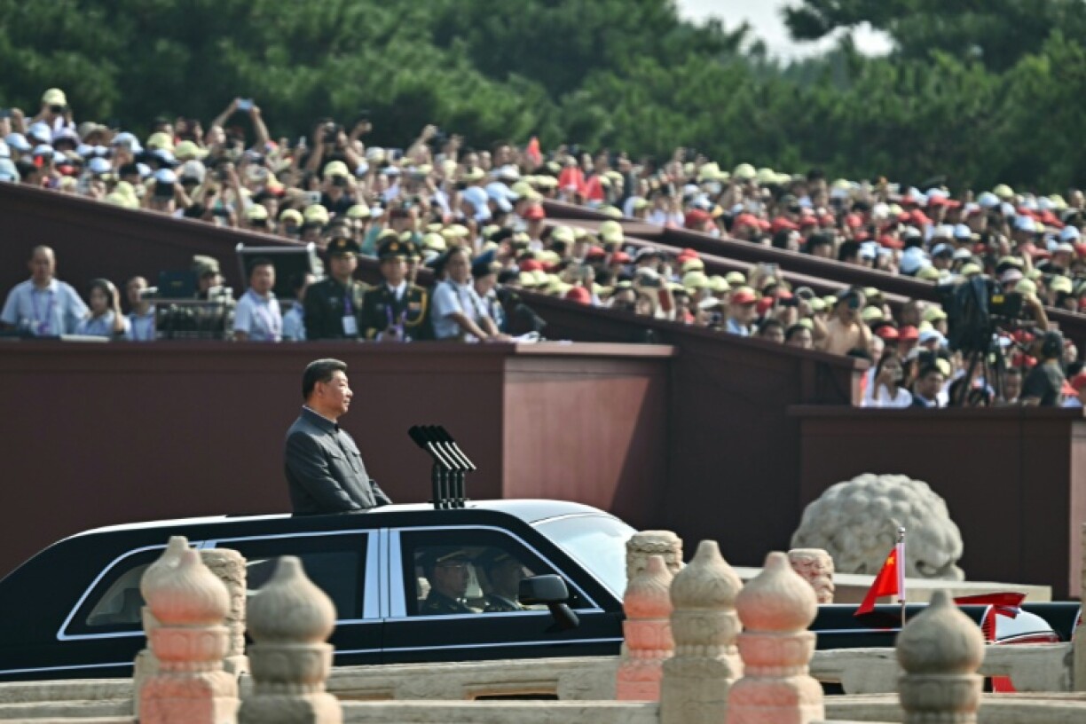 China's President Xi Jinping starts his inspection of the troops during a military parade marking the 80th anniversary of victory over Japan and the end of World War II, in Beijing’s Tiananmen Square