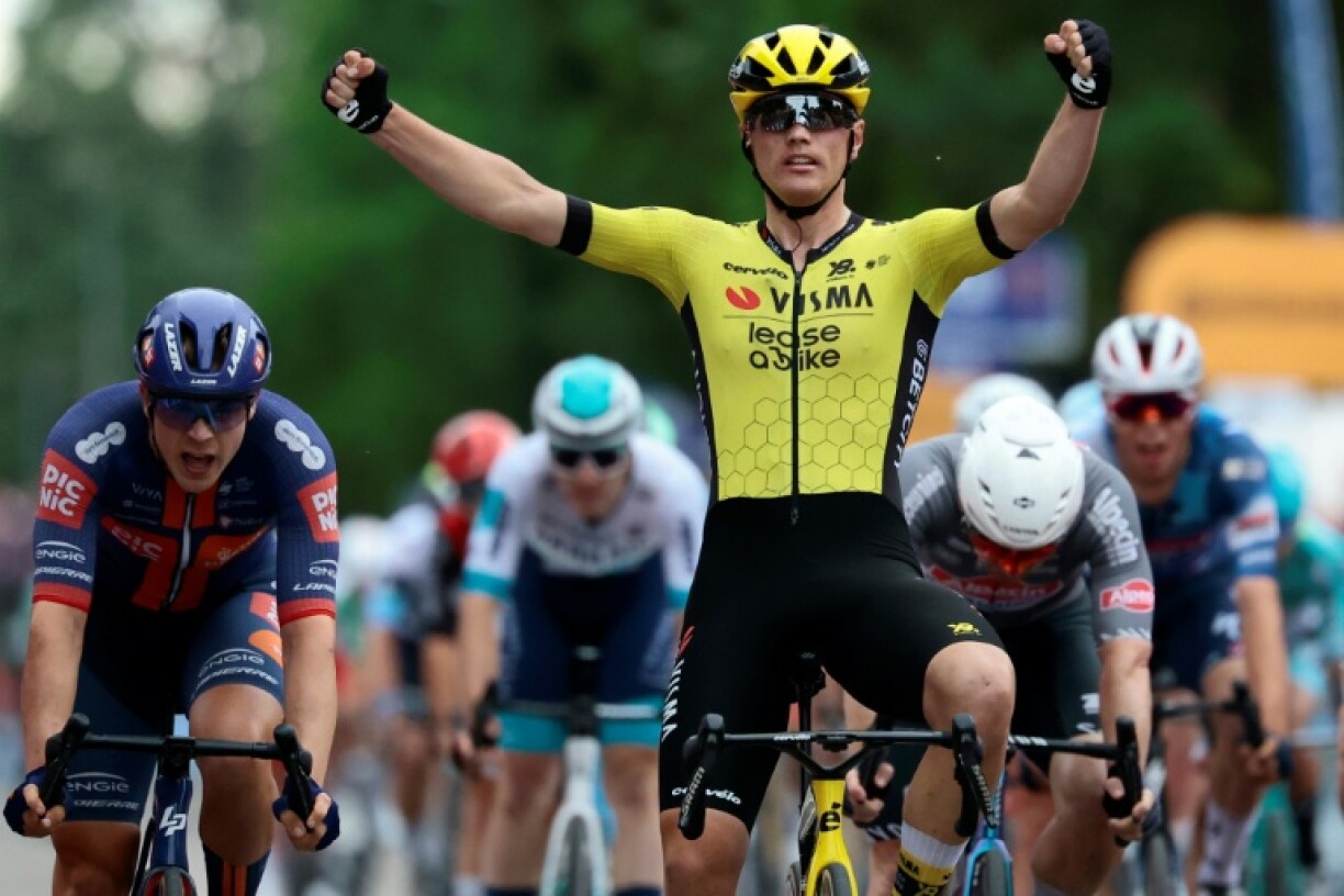 Olav Kooij celebrates his win in the 12th stage of the Giro